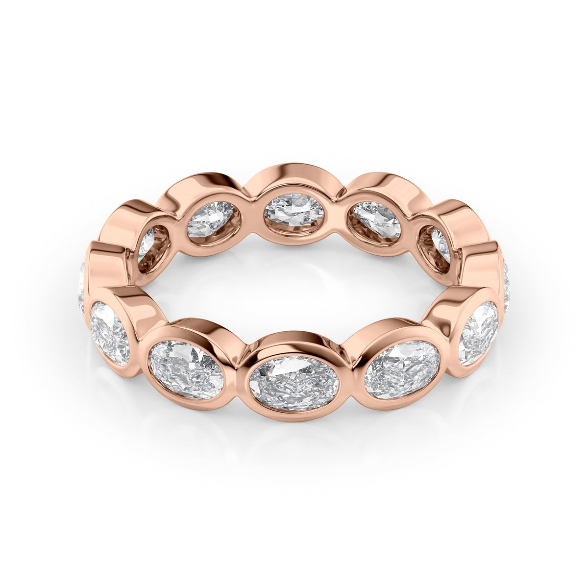 2.4ct East West Oval Bezel Eternity. A Rose Gold Eternity Ring Set With 2.4tcw Oval Lab Grown Diamonds. White Background.