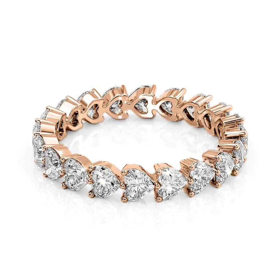 2.5ct Heart Shared Prong Eternity. A Rose Gold Eternity Ring Set With 2.5tcw Heart Lab Grown Diamonds. White Background.