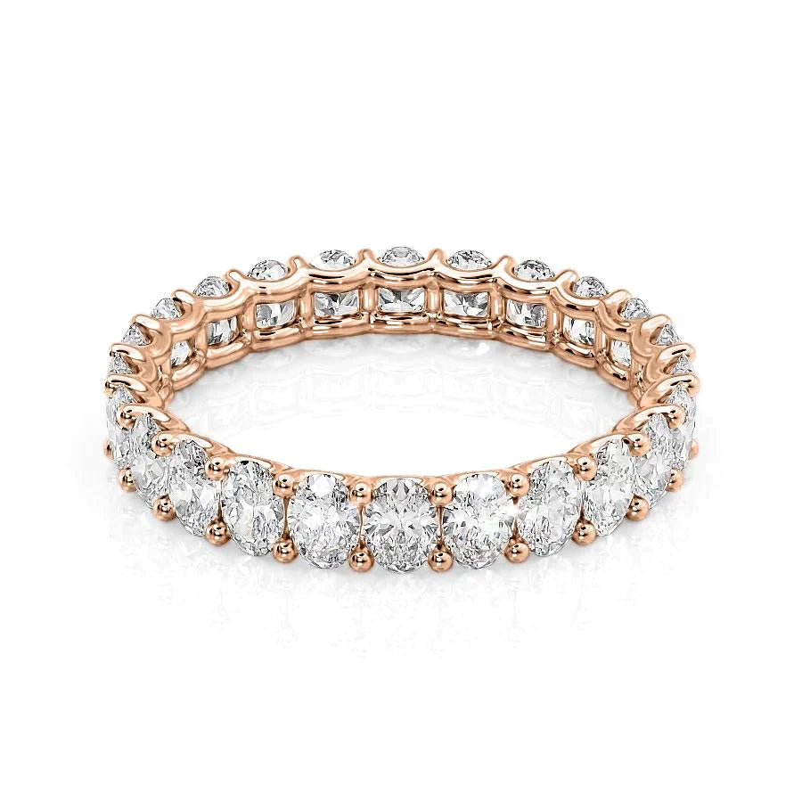 2.5ct Oval U Prong Eternity. A Rose Gold Eternity Ring Set With 2.5tcw Oval Lab Grown Diamonds. White Background.