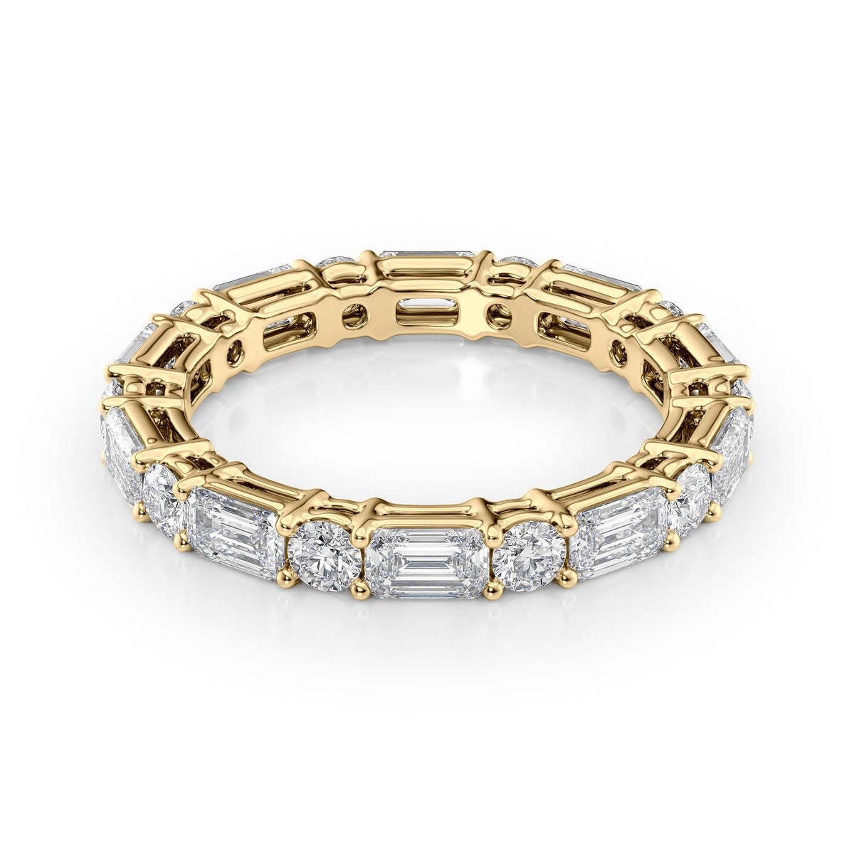 2.6ct Alternating Emerald And Round Basket Eternity. A Yellow Gold Eternity Ring Set With 2tcw Emerald Lab Grown Diamonds. White Background.