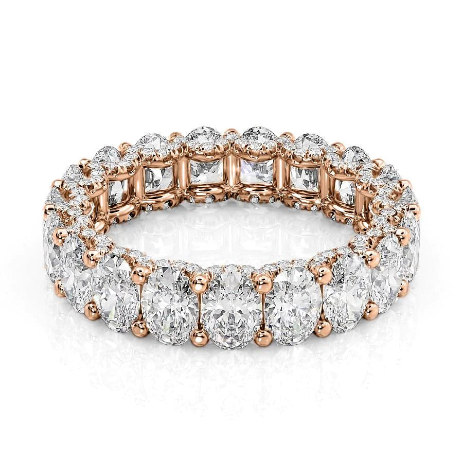 4.8ct Oval U Pave Prong Eternity. A Rose Gold Eternity Ring Set With 4.5tcw Oval Lab Grown Diamonds. White Background.