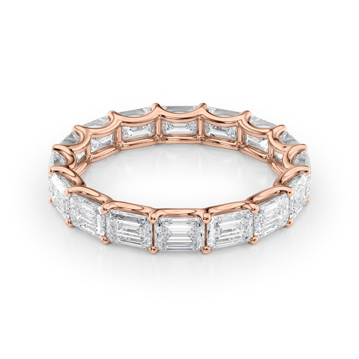 4ct East West Emerald U Prong Eternity. A Rose Gold Eternity Ring Set With 4tcw Emerald Lab Grown Diamonds. White Background.