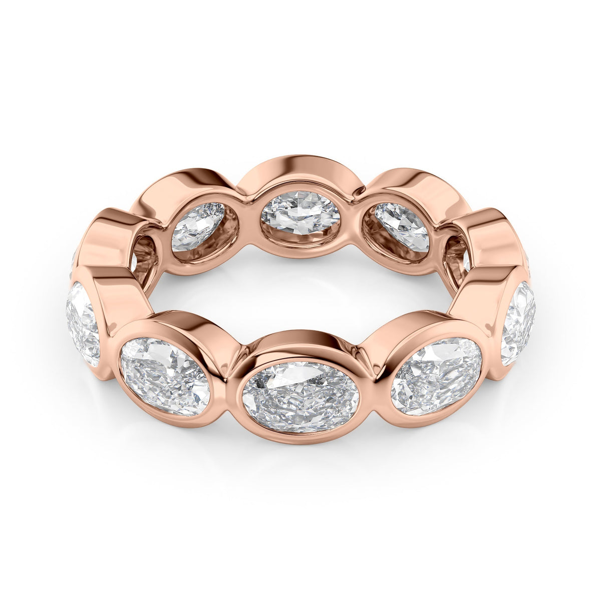 4ct East West Oval Bezel Eternity. A Rose Gold Eternity Ring Set With 4tcw Oval Lab Grown Diamonds. White Background.