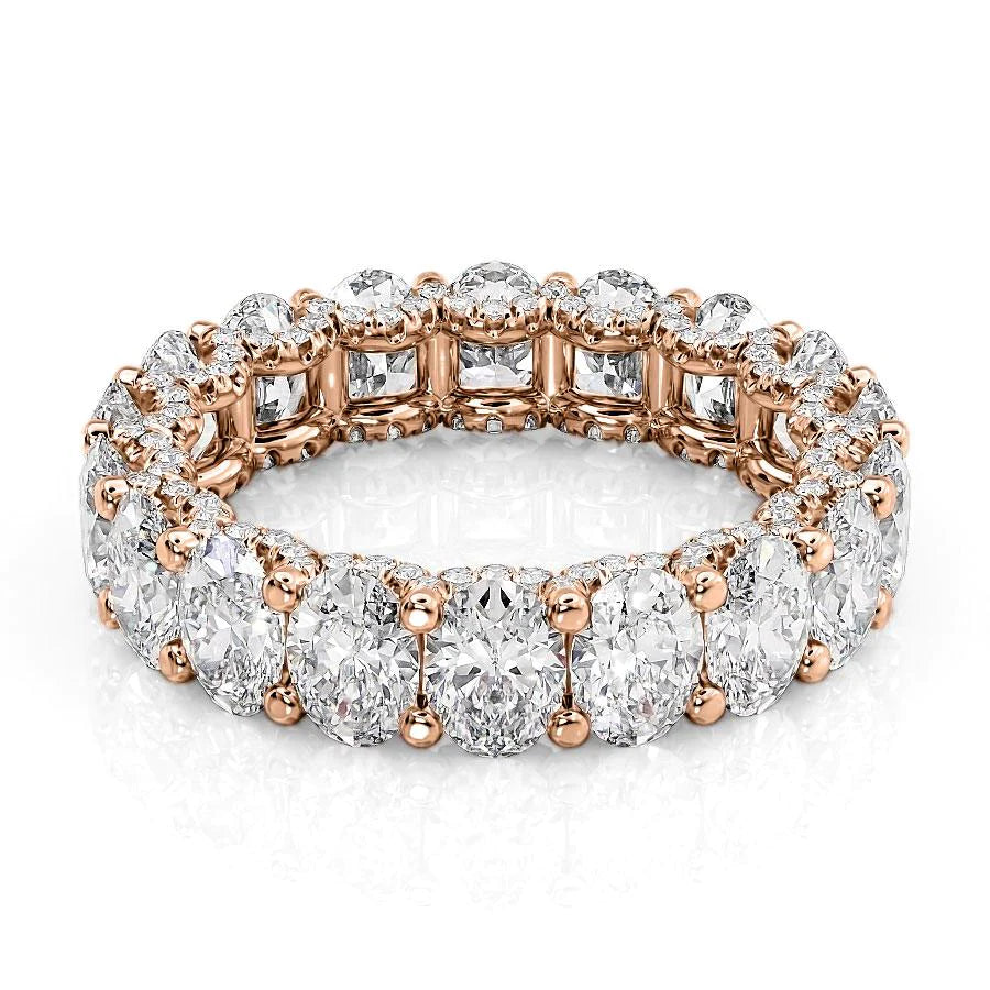 5.8ct Oval U Pave Prong Eternity. A Rose Gold Eternity Ring Set With 5.5tcw Oval Lab Grown Diamonds. White Background.
