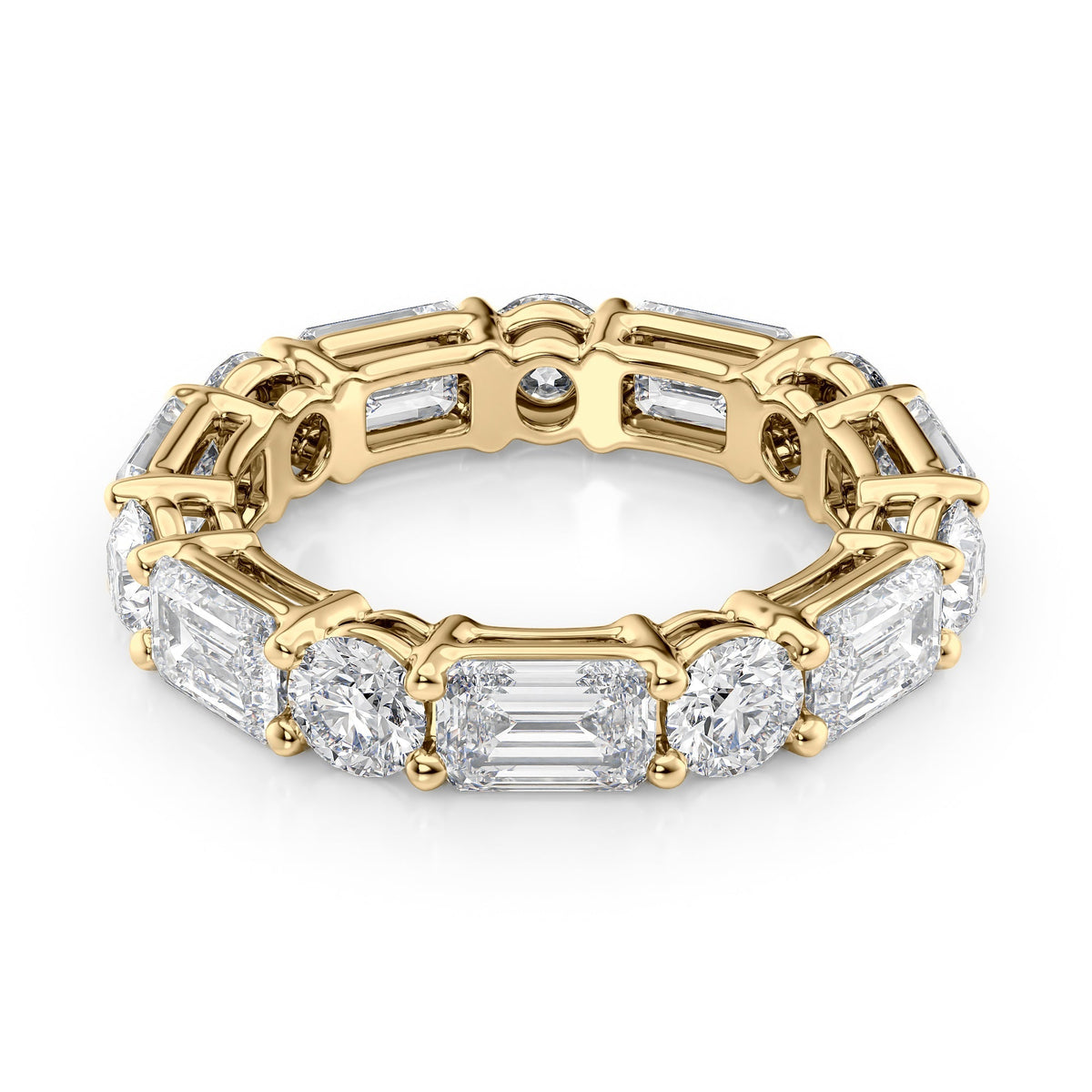 5ct Alternating Emerald And Round Basket Eternity. A Yellow Gold Eternity Ring Set With 3.5tcw Emerald Lab Grown Diamonds. White Background.