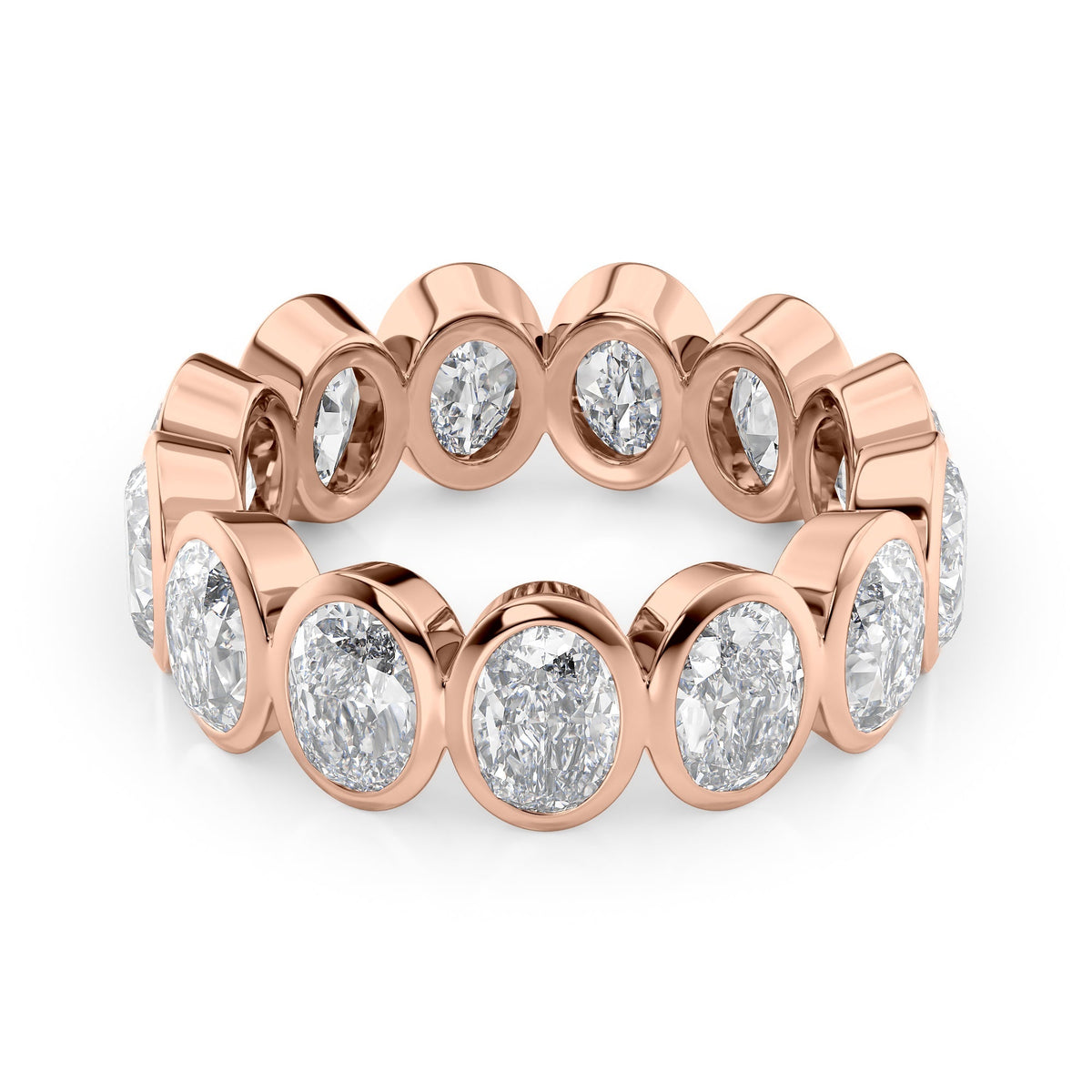 5ct Oval Bezel Eternity. A Rose Gold Eternity Ring Set With 5tcw Oval Lab Grown Diamonds. White Background.