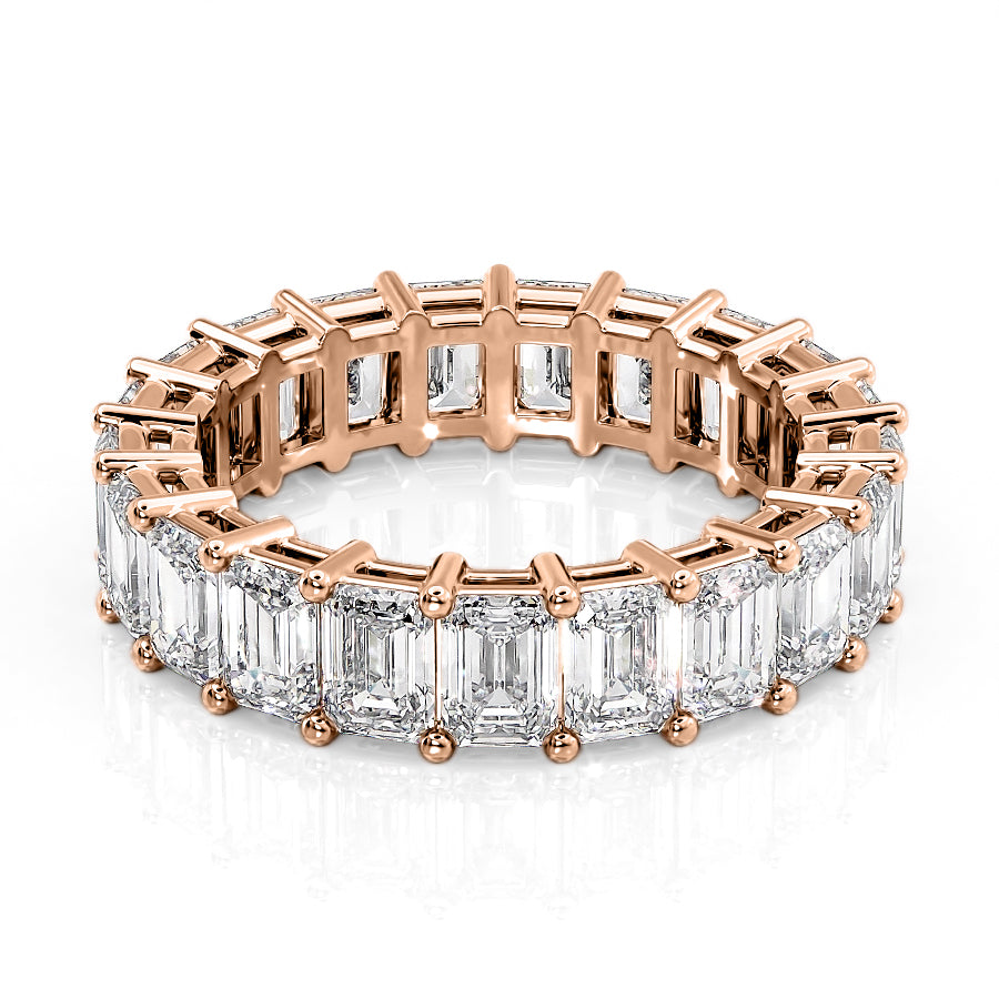 6ct Emerald Eternity. A Rose Gold Eternity Ring Set With 6tcw Emerald Lab Grown Diamonds. White Background.