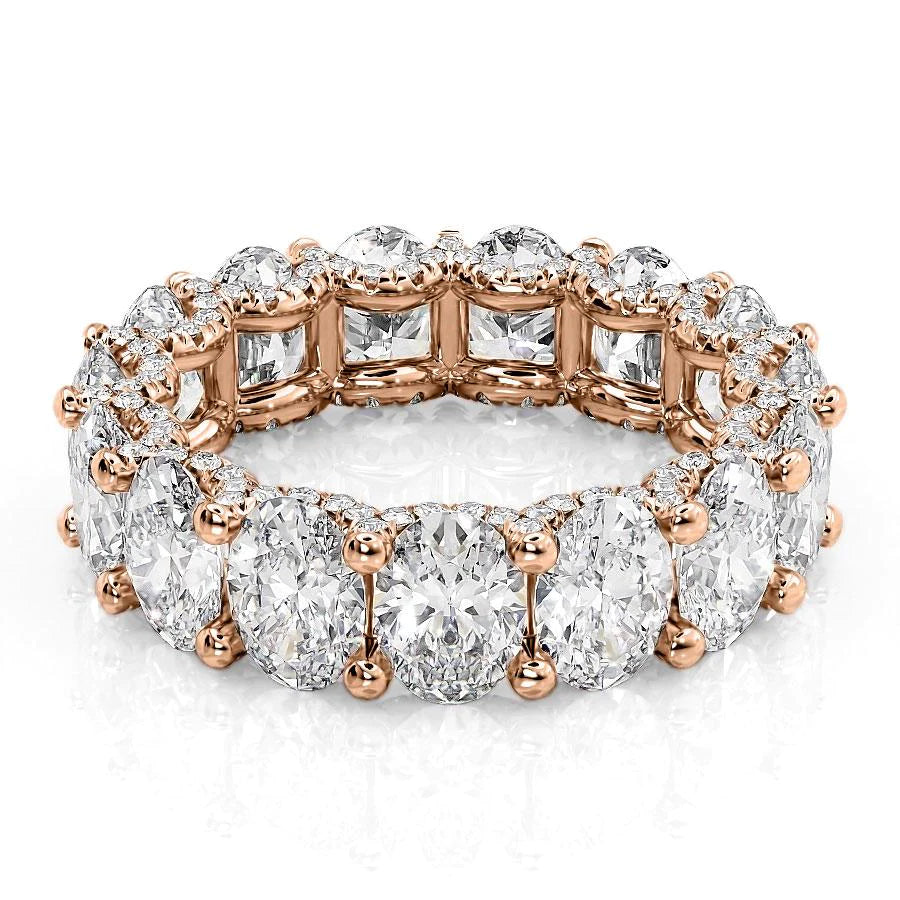 7.8ct Oval U Pave Prong Eternity. A Rose Gold Eternity Ring Set With 7.5tcw Oval Lab Grown Diamonds. White Background.