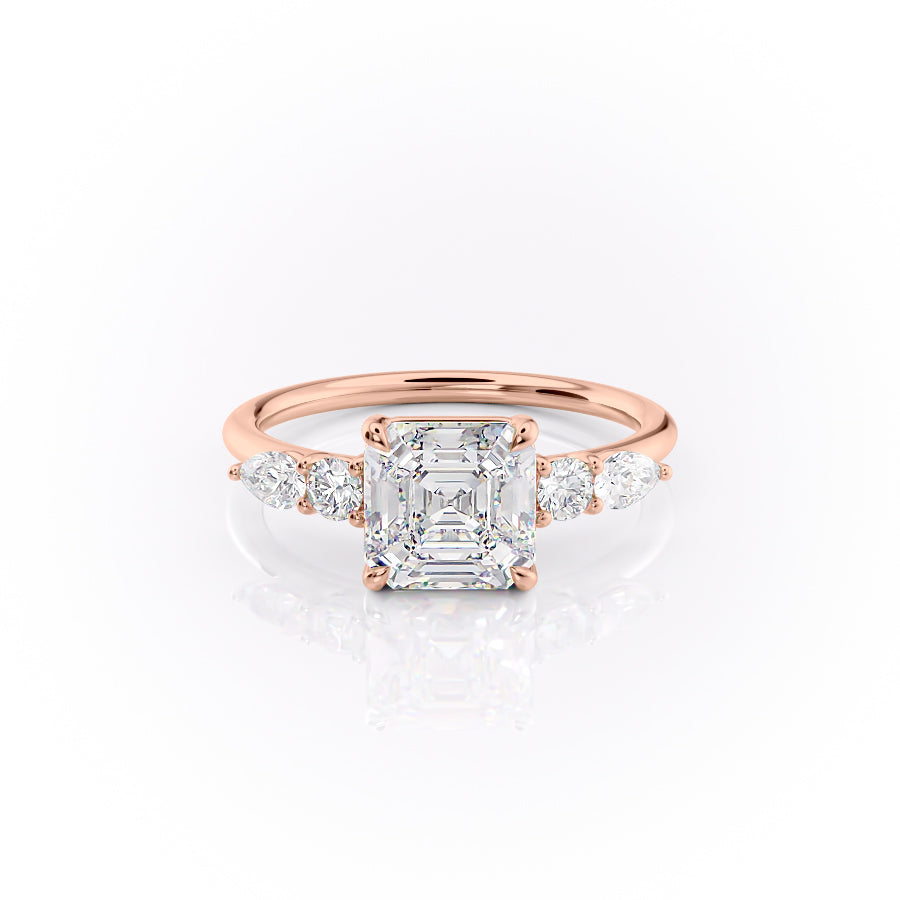 The Abigail. A Rose Gold Three Stone, Side Stones Engagement Ring Set With A 2ct Asscher Lab Grown Diamond. White Background.