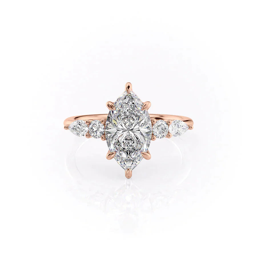 The Abigail. A Rose Gold Three Stone, Side Stones Engagement Ring Set With A 2ct Marquise Lab Grown Diamond. White Background.