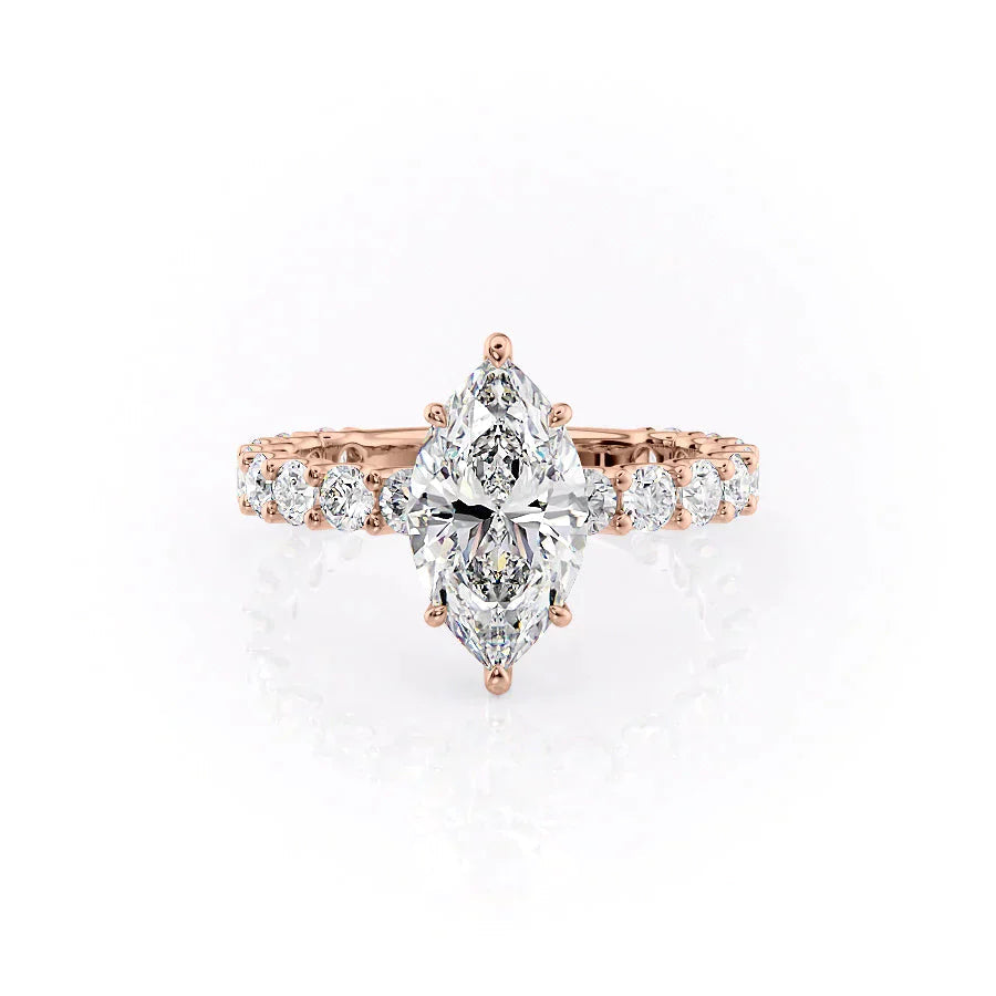 The Adelle. A Rose Gold Side Stones, Hidden Halo Engagement Ring Set With A 2ct Marquise Lab Grown Diamond. White Background.