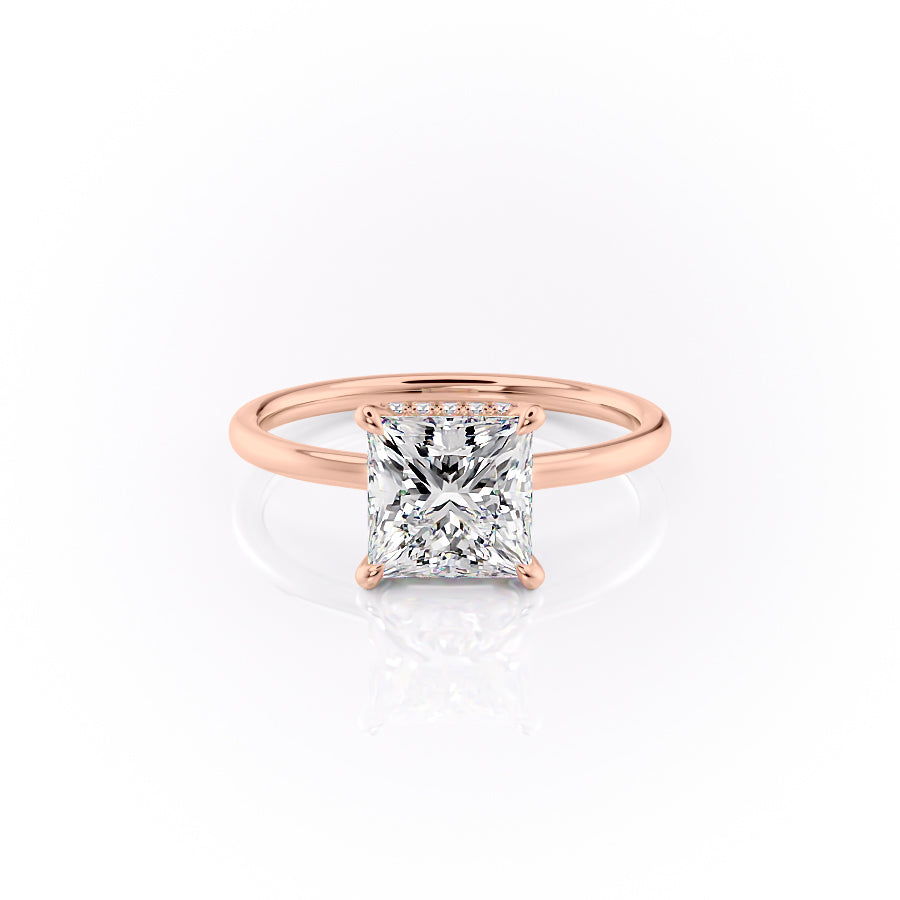 The Aline. A Rose Gold Solitaire, Hidden Halo Engagement Ring Set With A 2ct Princess Lab Grown Diamond. White Background.