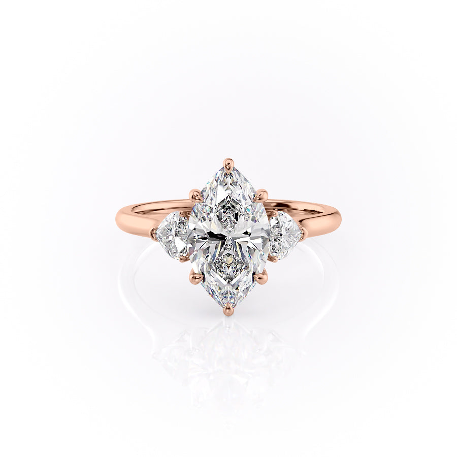 The Hearts Liv. A Rose Gold Three Stone Engagement Ring Set With A 2ct Marquise Lab Grown Diamond. White Background.