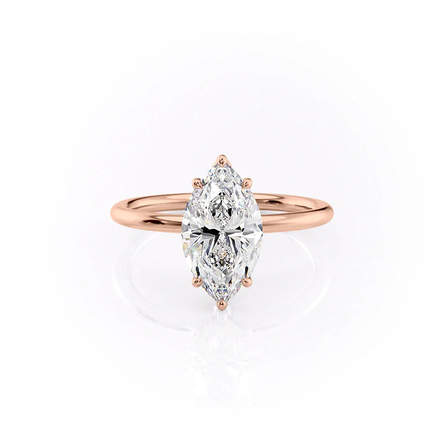 The Lily. A Rose Gold Solitaire, Nature Engagement Ring Set With A 2ct Marquise Lab Grown Diamond. White Background.