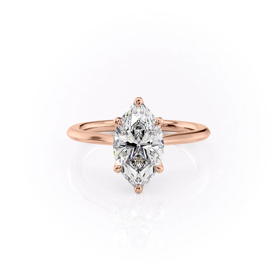The Madison. A Rose Gold Solitaire, Nature Engagement Ring Set With A 2ct Marquise Lab Grown Diamond. White Background.