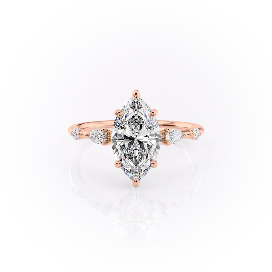 The Naomi. A Rose Gold Three Stone, Side Stones, Hidden Halo Engagement Ring Set With A 2ct Marquise Lab Grown Diamond. White Background.