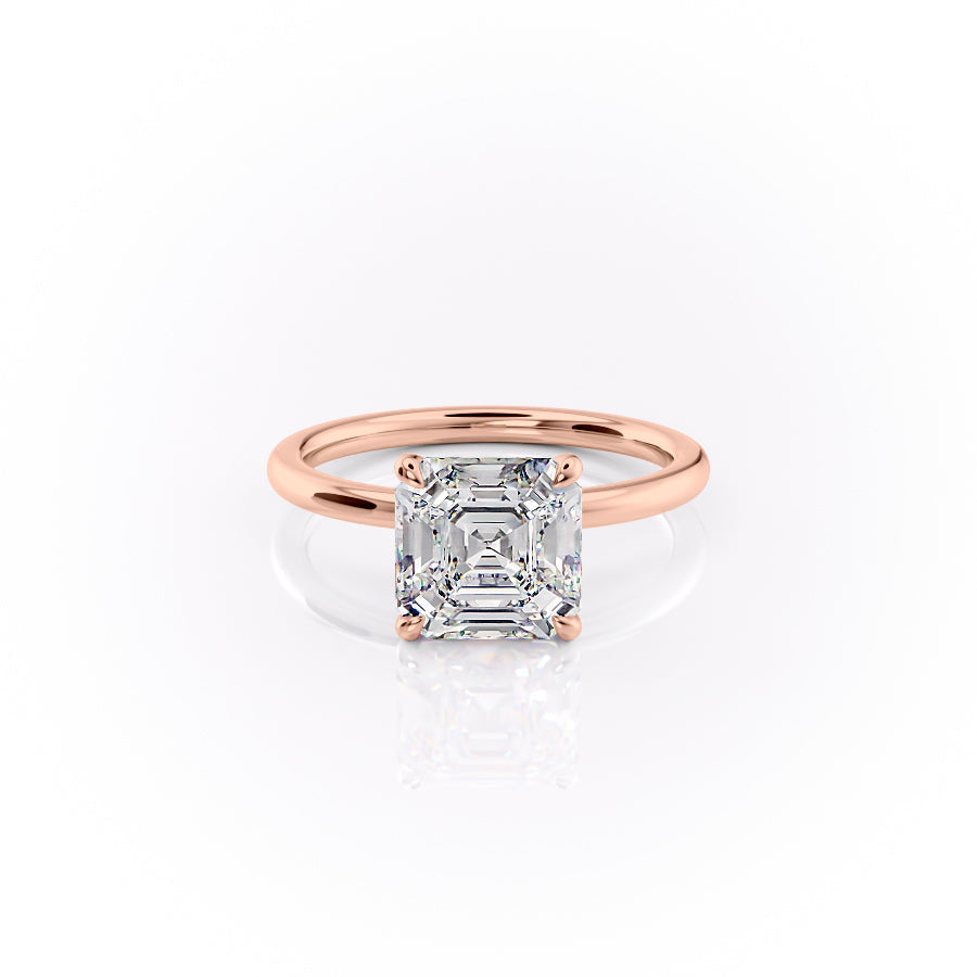 The Nelly. A Rose Gold Solitaire, Hidden Halo Engagement Ring Set With A 2ct Asscher Lab Grown Diamond. White Background.