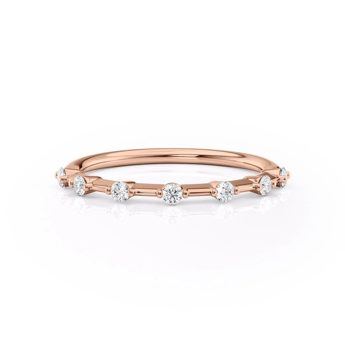 The Penelope. A Rose Gold Prong Wedding Band Set With 0.15tcw Round Lab Grown Diamonds. White Background.