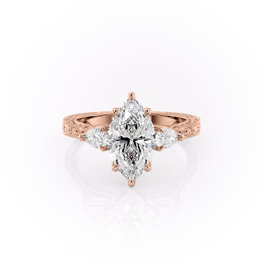 The Three Stone Sierra. A Rose Gold Vintage Engagement Ring Set With A 2ct Marquise Lab Grown Diamond. White Background.