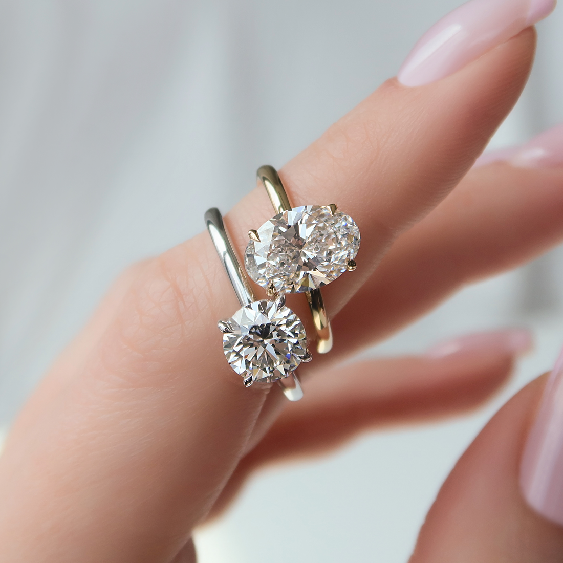 Choosing between round vs oval diamond? See how both look on designs like The Kamellie and Low Profile Kamellie.