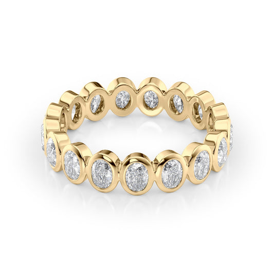 1.7ct Oval Bezel Eternity. A Yellow Gold Eternity Ring Set With 1.7tcw Oval Lab Grown Diamonds. White Background.