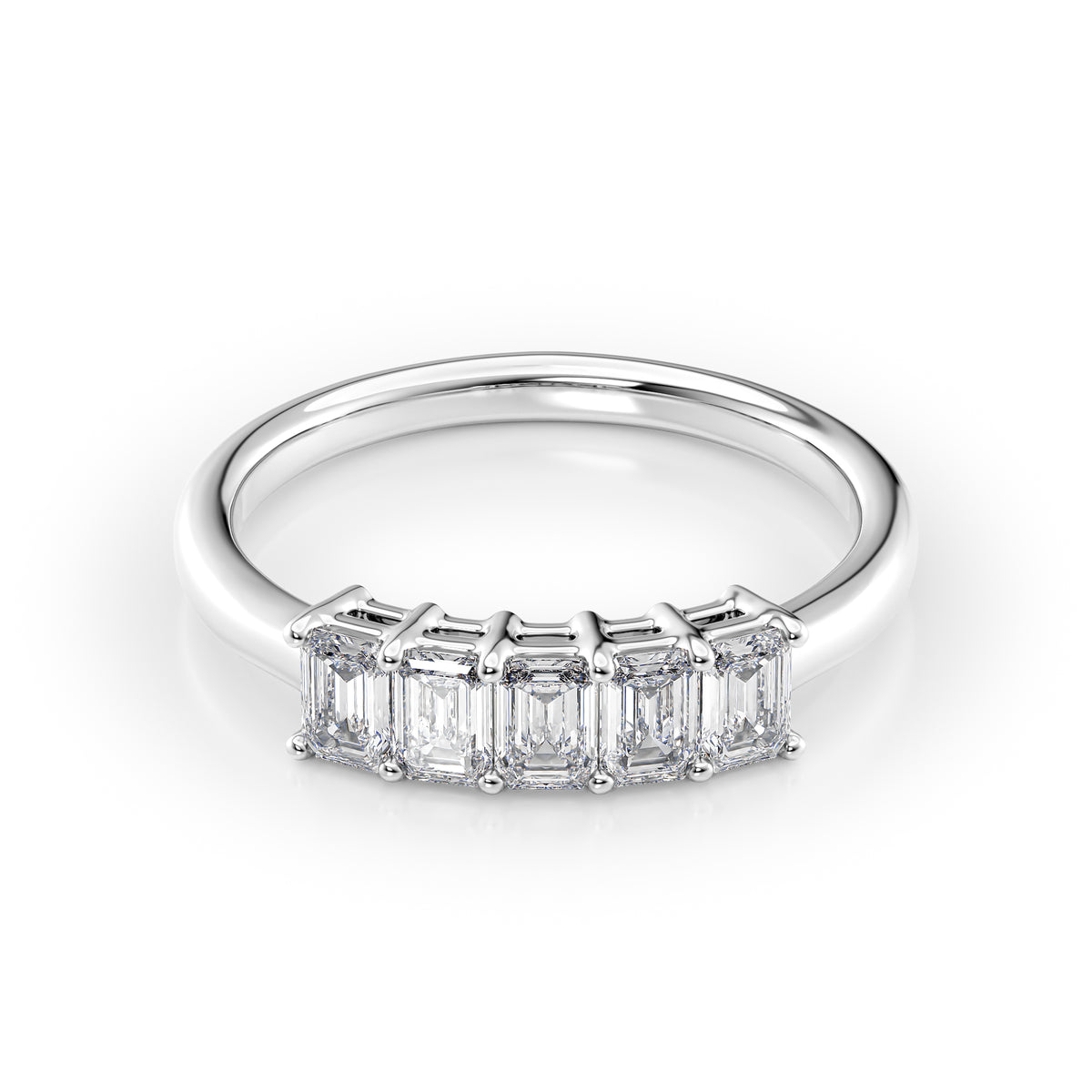 1ct Emerald Anniversary. A White Gold Anniversary Ring Set With 1tcw Emerald Lab Grown Diamonds. White Background.