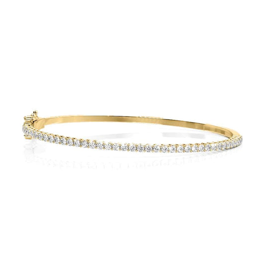 1ct Eternity Bangle. A Yellow Gold Bangle Bracelet Set With 1tcw Round Lab Grown Diamonds. White Background.
