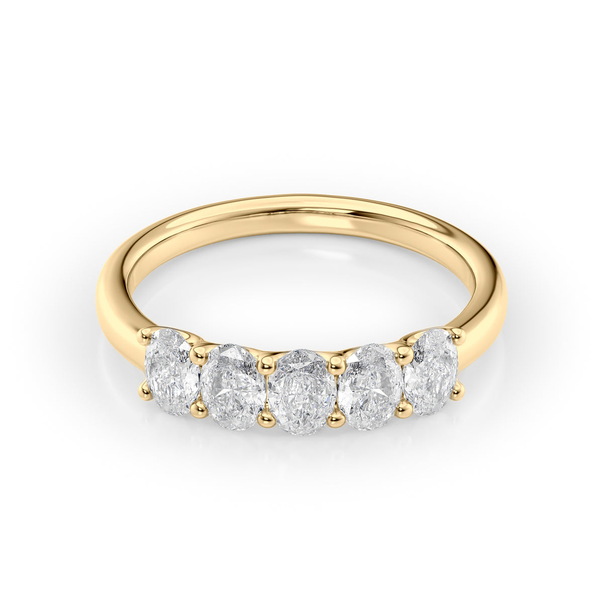 1ct Oval U Prong Anniversary. A Yellow Gold Anniversary Ring Set With 1tcw Oval Lab Grown Diamonds. White Background.