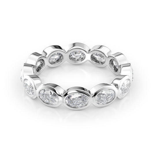 2.4ct East West Oval Bezel Eternity. A White Gold Eternity Ring Set With 2.4tcw Oval Lab Grown Diamonds. White Background.