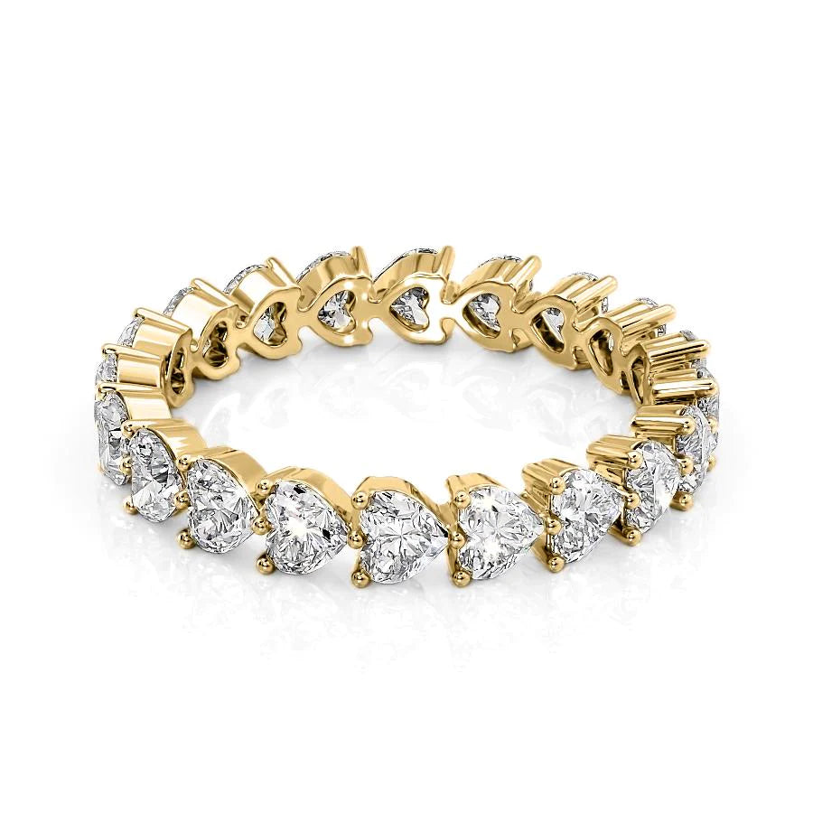 2.5ct Heart Shared Prong Eternity. A Yellow Gold Eternity Ring Set With 2.5tcw Heart Lab Grown Diamonds. White Background.
