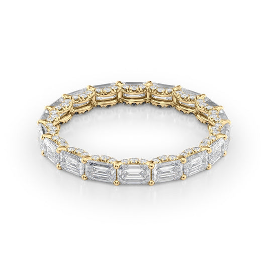 2.8ct East West Emerald U Pave Prong Eternity. A Yellow Gold Eternity Ring Set With 2.5tcw Emerald Lab Grown Diamonds. White Background.