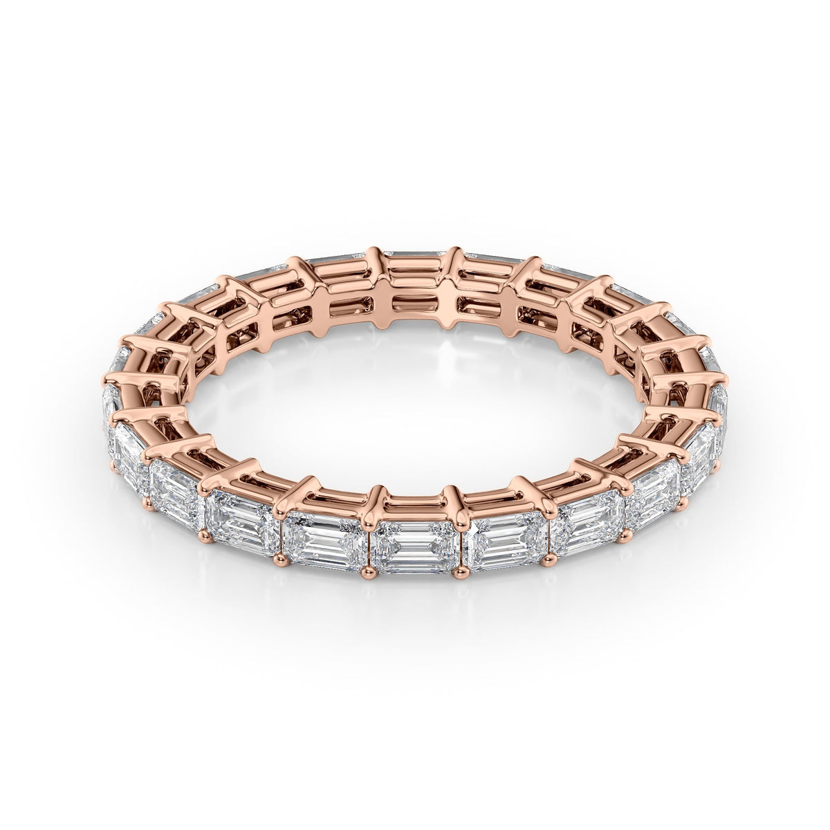 2ct East West Emerald Eternity. A Rose Gold Eternity Ring Set With 2tcw Emerald Lab Grown Diamonds. White Background.