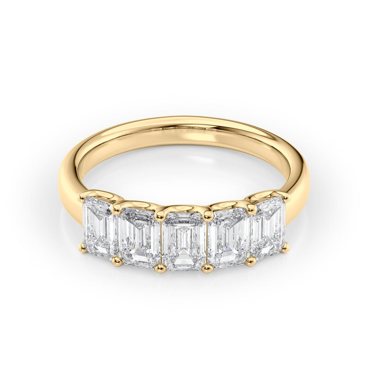 2ct Emerald U Prong Anniversary. A Yellow Gold Anniversary Ring Set With 2tcw Emerald Lab Grown Diamonds. White Background.