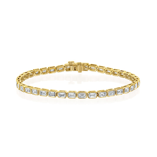 3.5ct East West Bezel Emerald Tennis Bracelet. A Yellow Gold Tennis Bracelet Set With 3.5tcw Emerald Lab Grown Diamonds. White Background.