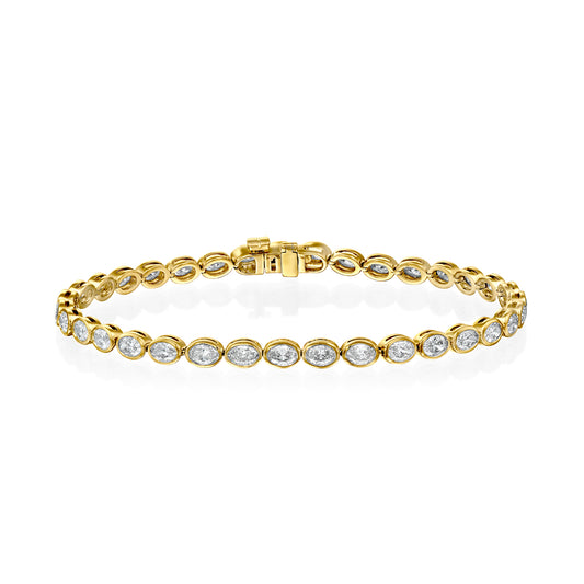 3.5ct East West Bezel Oval Tennis Bracelet. A Yellow Gold Tennis Bracelet Set With 3.5tcw Oval Lab Grown Diamonds. White Background.