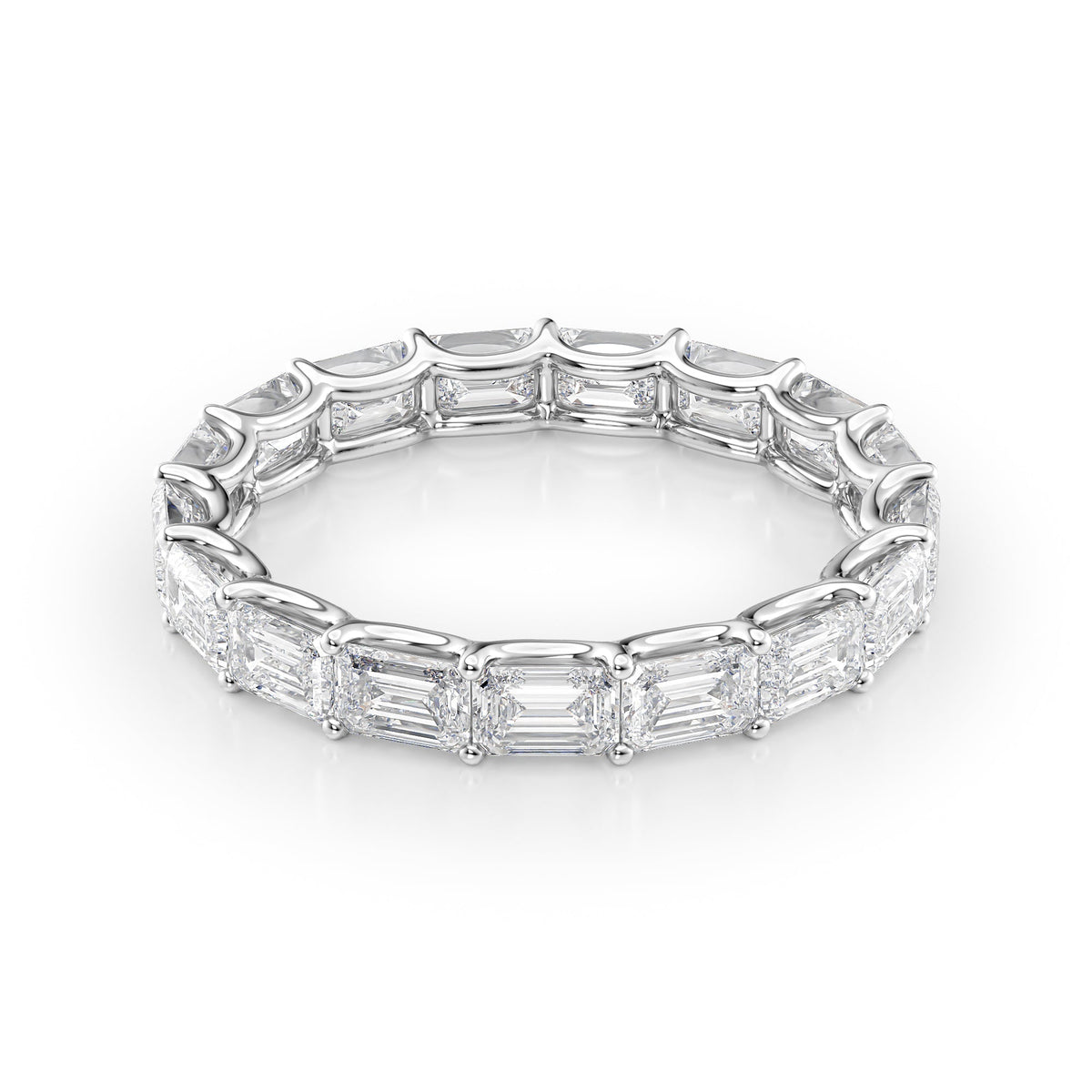 3.5ct East West Emerald U Prong Eternity. A White Gold Eternity Ring Set With 3.5tcw Emerald Lab Grown Diamonds. White Background.