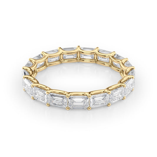 3.5ct East West Emerald U Prong Eternity. A Yellow Gold Eternity Ring Set With 3.5tcw Emerald Lab Grown Diamonds. White Background.