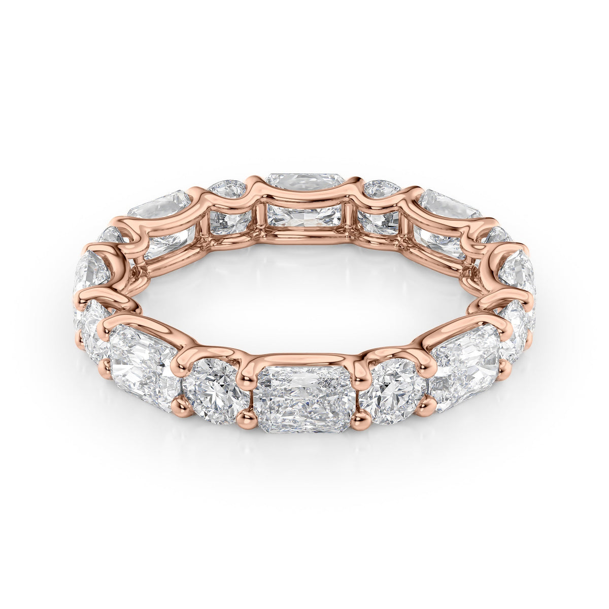 3.7ct Alternating Radiant And Round U Prong Eternity. A Rose Gold Eternity Ring Set With 2.7tcw Radiant Lab Grown Diamonds. White Background.