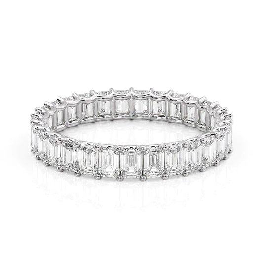 3ct Emerald U Prong Eternity. A White Gold Eternity Ring Set With 3tcw Emerald Lab Grown Diamonds. White Background.