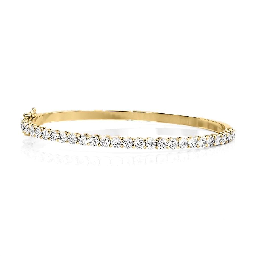 3ct Eternity Bangle. A Yellow Gold Bangle Bracelet Set With 3tcw Round Lab Grown Diamonds. White Background.