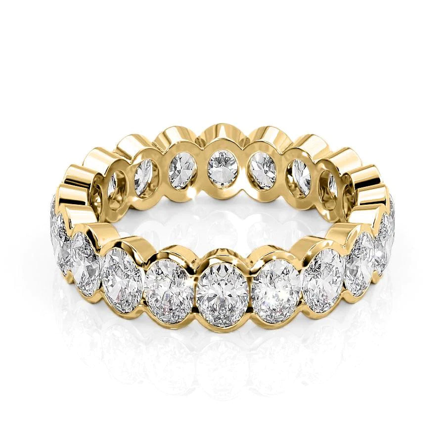 3ct Oval Half Bezel Eternity. A Yellow Gold Eternity Ring Set With 3tcw Oval Lab Grown Diamonds. White Background.