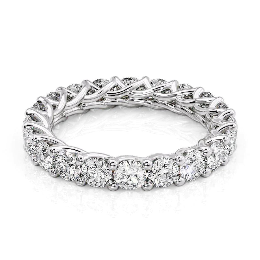3ct Round Trellis Eternity. A White Gold Eternity Ring Set With 3tcw Round Lab Grown Diamonds. White Background.
