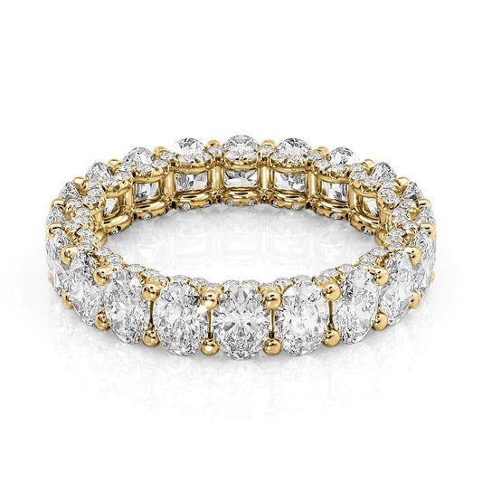 4.3ct Oval U Pave Prong Eternity. A Yellow Gold Eternity Ring Set With 4tcw Oval Lab Grown Diamonds. White Background.