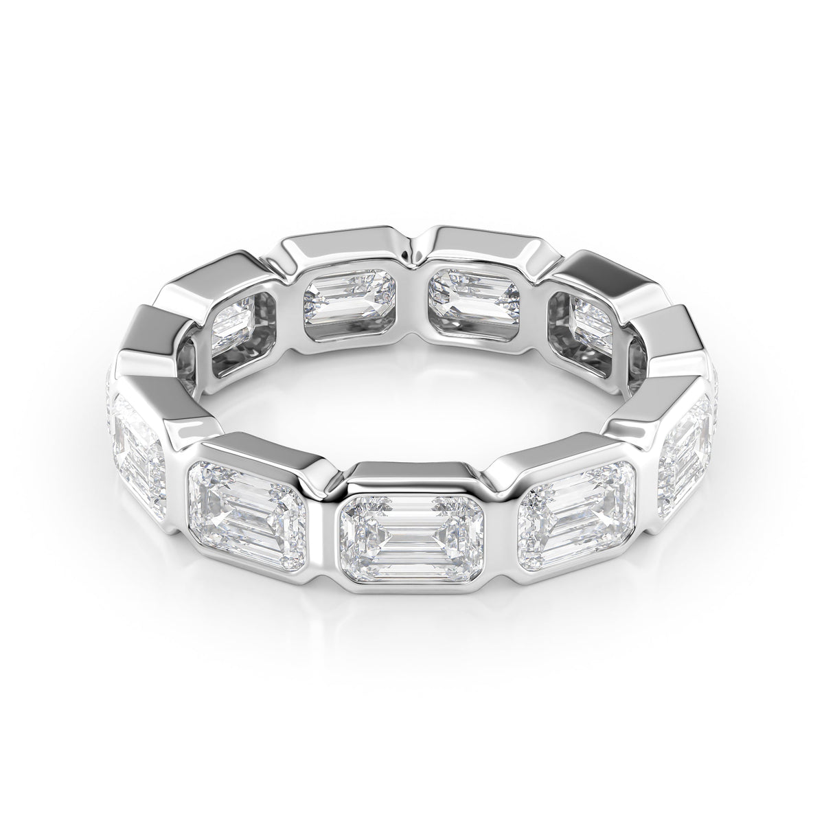 4.5ct East West Emerald Bezel Eternity. A White Gold Eternity Ring Set With 4.5tcw Emerald Lab Grown Diamonds. White Background.
