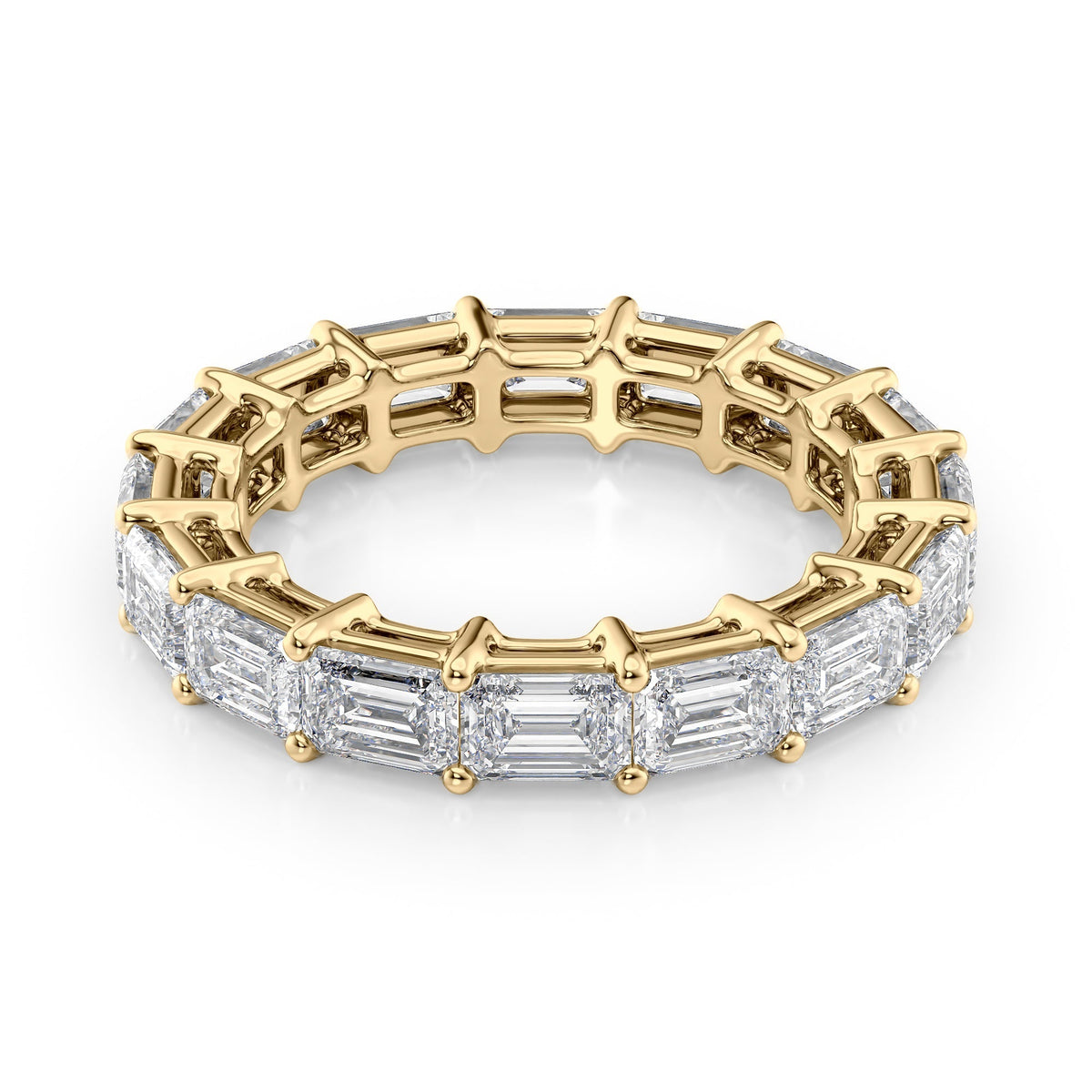 4.5ct East West Emerald Eternity. A Yellow Gold Eternity Ring Set With 4.5tcw Emerald Lab Grown Diamonds. White Background.
