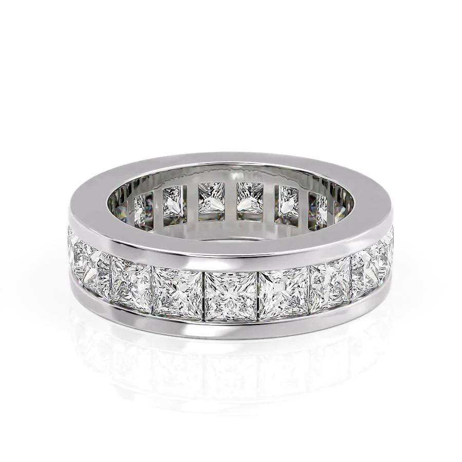 4.7ct Princess Channel Eternity. A White Gold Eternity Ring Set With 4.7tcw Princess Lab Grown Diamonds. White Background.