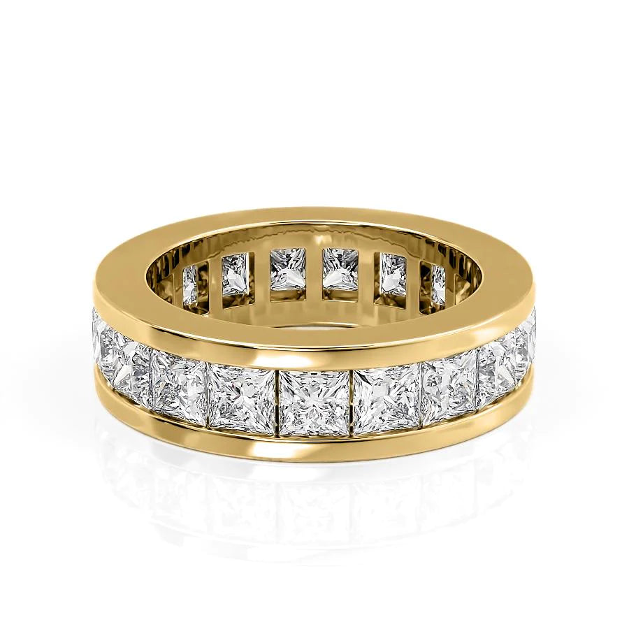 4.7ct Princess Channel Eternity. A Yellow Gold Eternity Ring Set With 4.7tcw Princess Lab Grown Diamonds. White Background.