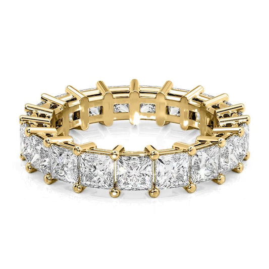4.7ct Princess Eternity. A Yellow Gold Eternity Ring Set With 4.7tcw Princess Lab Grown Diamonds. White Background.