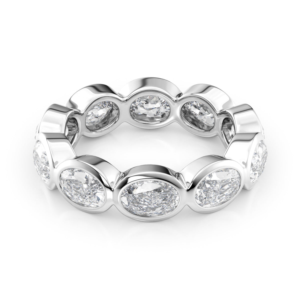 4ct East West Oval Bezel Eternity. A White Gold Eternity Ring Set With 4tcw Oval Lab Grown Diamonds. White Background.