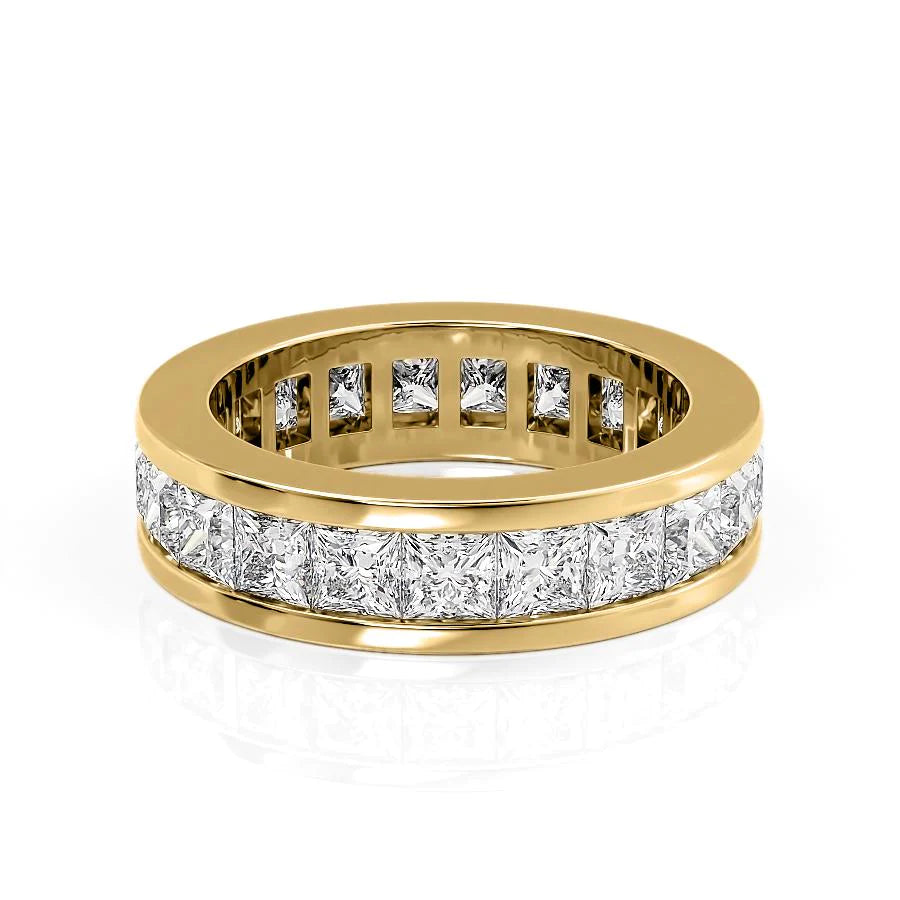 4ct Princess Channel Eternity. A Yellow Gold Eternity Ring Set With 4tcw Princess Lab Grown Diamonds. White Background.